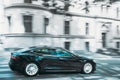 Black Color Tesla Model S 100d Car Fast Drive In Summer City Street. The Tesla Model S Is A Full-sized All-electric Five Royalty Free Stock Photo