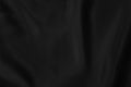 Black colored Background of soft draped fabric