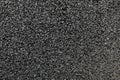 Black colored granulated material texture Royalty Free Stock Photo