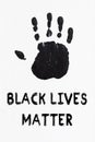 Black colored print of a hand, symbol of antiracism