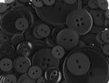 Black colored sewing buttons isolated on white Royalty Free Stock Photo
