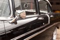 Black colored vintage classic American car parked on the street of Havana, Cuba. Retro car details Royalty Free Stock Photo