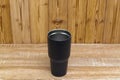 Black colour stainless steel tumbler or cold and hot storage cup on wood Royalty Free Stock Photo
