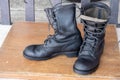 The black combats on a wood floor. Royalty Free Stock Photo