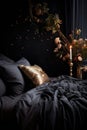 Black Comforter Bed With Vase of Flowers