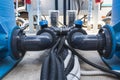 Black communication pipes with valves and black hoses