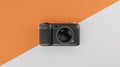 Black compact camera over orange and white background travel concept. 3d rendering