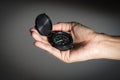 Black compass in woman hand Royalty Free Stock Photo