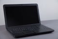 Black computer on gray table with empty screen Royalty Free Stock Photo
