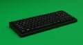 Black computer keyboard on a solid green background. The keyboard features a full Royalty Free Stock Photo