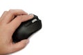 Black computer mouse in hand isolated on a white background. Close-up. Royalty Free Stock Photo