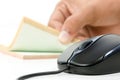 Black computer mouse and writing pad Royalty Free Stock Photo