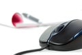 Black computer mouse and writing pad Royalty Free Stock Photo