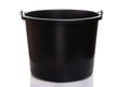 Black construction plastic bucket with a metal handle on a white isolated background Royalty Free Stock Photo