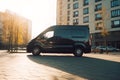 Black contemporary unbranded mock up EV minibus in summer city