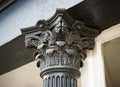 A corinthian capital atop a fluted column.