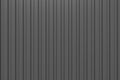 Black corrugated metal texture, dark abstract background. 3d texture