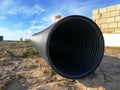 Black corrugated pipe for water canalization Royalty Free Stock Photo