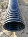 Black corrugated pipe for water canalization Royalty Free Stock Photo