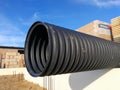 Black corrugated pipe for water canalization Royalty Free Stock Photo