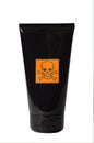 Black cosmetics tube with danger sign