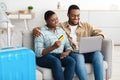 Black Couple Buying Travel Tickets Online Using Laptop At Home Royalty Free Stock Photo