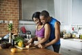 Black couple cooking healthy food in the kitchen Royalty Free Stock Photo