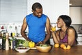 Black couple cooking healthy food in the kitchen Royalty Free Stock Photo