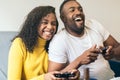 Black couple enjoying playing video game at home. laughing and smiling Royalty Free Stock Photo