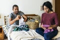 Black couple folding clothes together Royalty Free Stock Photo