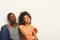 Black couple looking up sitting on floor Royalty Free Stock Photo