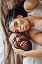 Black couple, love and bedroom selfie while happy and funny together with tongue out on bed at home, apartment or hotel Royalty Free Stock Photo