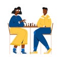 Black couple plays chess.