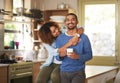 Black couple relaxing, drinking coffee and looking happy together in the kitchen in the morning at home. Portrait of a Royalty Free Stock Photo