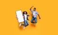 Black couple showing white empty smartphone screen and jumping Royalty Free Stock Photo