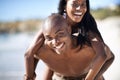 Black couple, smiling and piggyback with portrait, beach and married for summer vacation. African, enjoying and happy Royalty Free Stock Photo