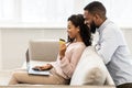 Black couple using computer and debit credit card at home Royalty Free Stock Photo