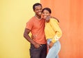 Black couple, youth and fashion with gen z, hug and together with color and portrait against wall background. Black man