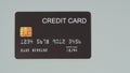 Black credit card isolated on grey background.Nopeople