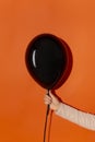 Black creepy halloween balloon with copy space for text