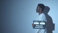 Black criminal holds a sign for a photo in the police Royalty Free Stock Photo