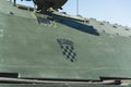 Black Croatian flag printed on dark green military vehicle. Modern military vehicles at the demonstration