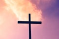 Black cross on a background of red and purple flaming sky, from