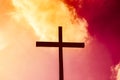 Black cross on a background of red and yellow flaming sky, from Royalty Free Stock Photo