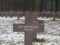 Black cross on grave on the cemetery of Ysselstein for an german unknown soldier in the Netherlands Royalty Free Stock Photo