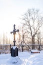 Black cross in memory of buried here Christians. It installed before temple in Verh-Nevinsky, Russia