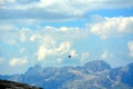 Black crow flying in the mountains Royalty Free Stock Photo