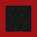 Black crumpled paper on red background Royalty Free Stock Photo