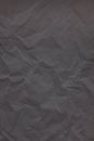 Black crumpled wrinkled textured paper background Royalty Free Stock Photo