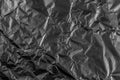 Black crushed damaged aluminum metal foil texture Royalty Free Stock Photo